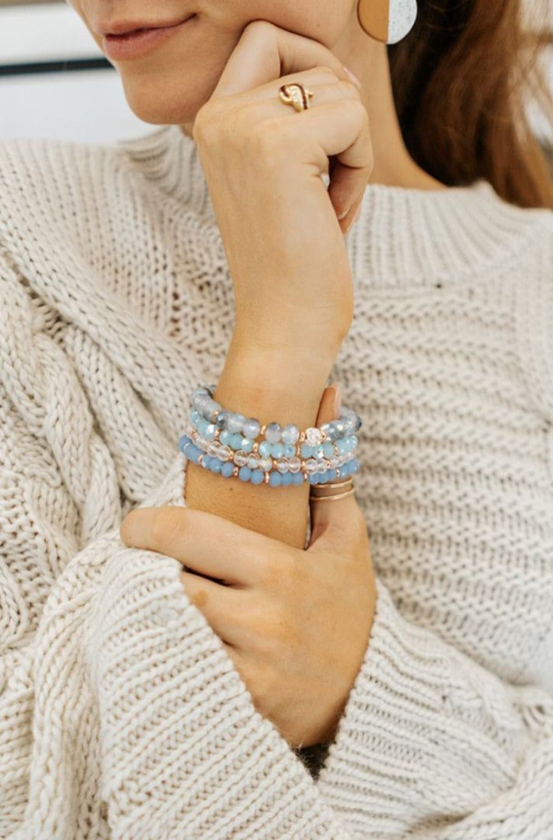 Blue and White Beaded Bracelet Stacks with Knitwear — Bangle Stacks