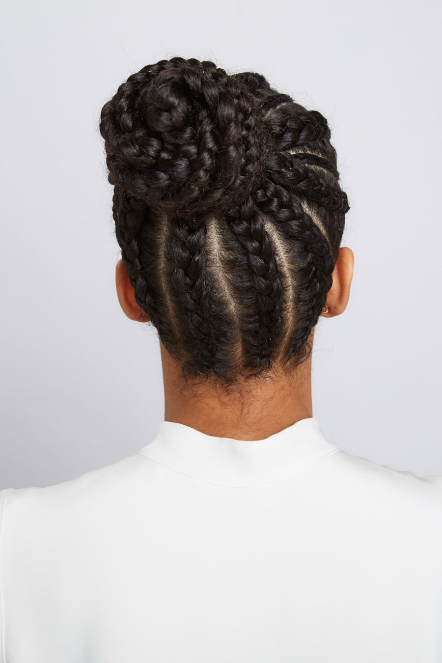 Coily Cornrows Forming a Textured Bun Coily Cornrows Forming a Textured Bun — Cornrow Bun
