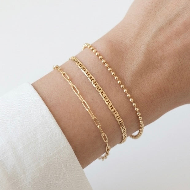 Varied Gold Bracelet Stack with Collared Shirt — Gold Jewelry Stack