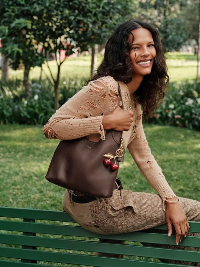 Relaxed Knitwear with Plaid Trousers and Bucket Bag Relaxed Knitwear with Plaid Trousers and Bucket Bag — Coach Bag Outfits
