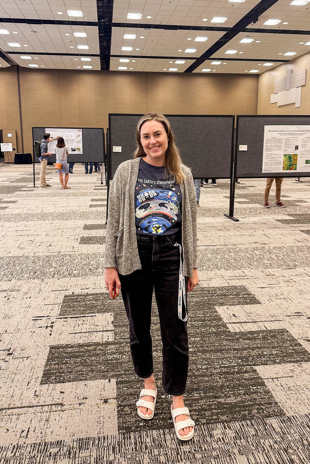 Space-Themed Graphic Tee Under a Grey Knit Cardigan and Straight-Leg Jeans Space-Themed Graphic Tee Under a Grey Knit Cardigan and Straight-Leg Jeans — Teacher Conference Outfits
