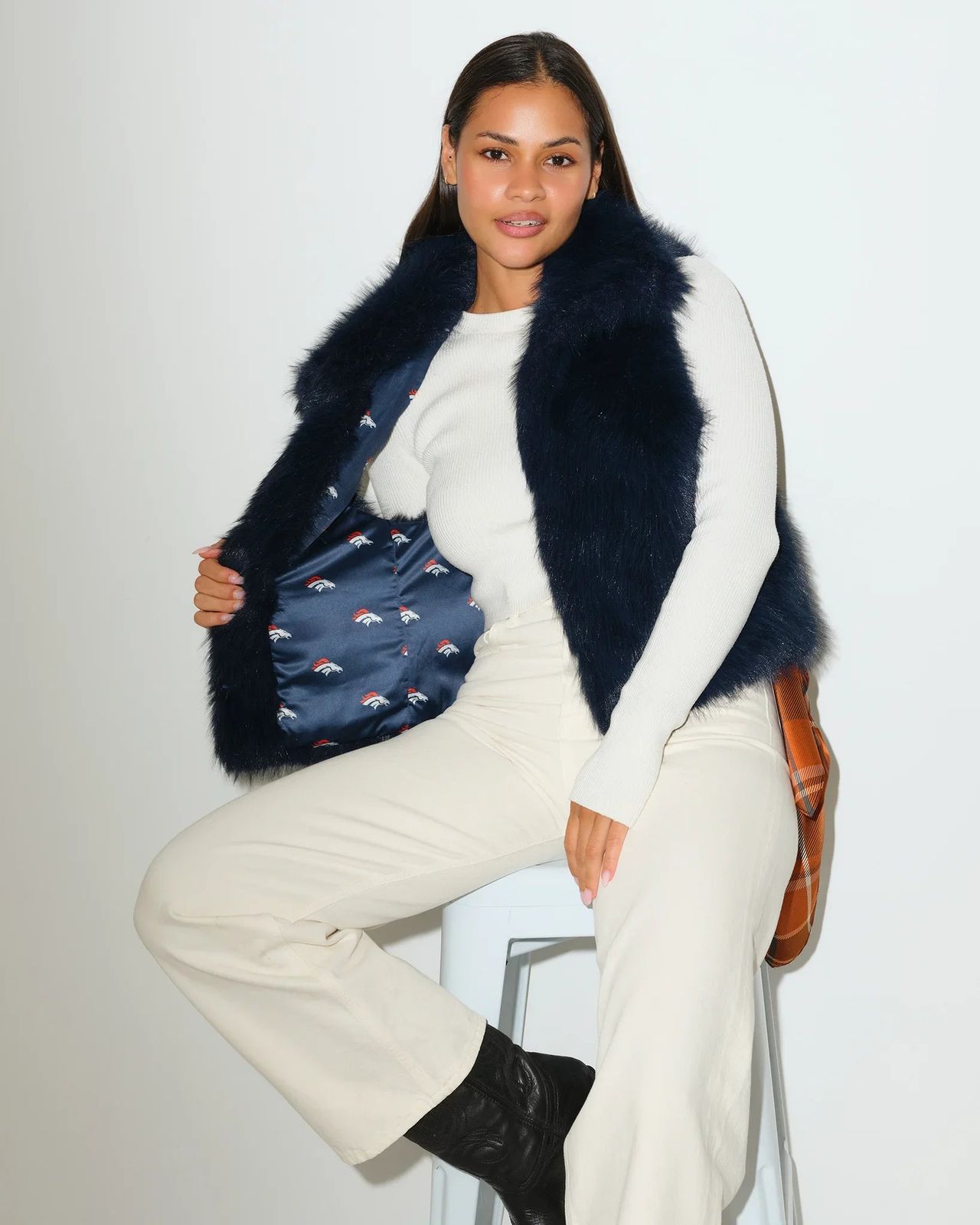 Sporty Chic: Navy Fur Vest with Subtle Team Spirit Sporty Chic: Navy Fur Vest with Subtle Team Spirit — Denver Outfits
