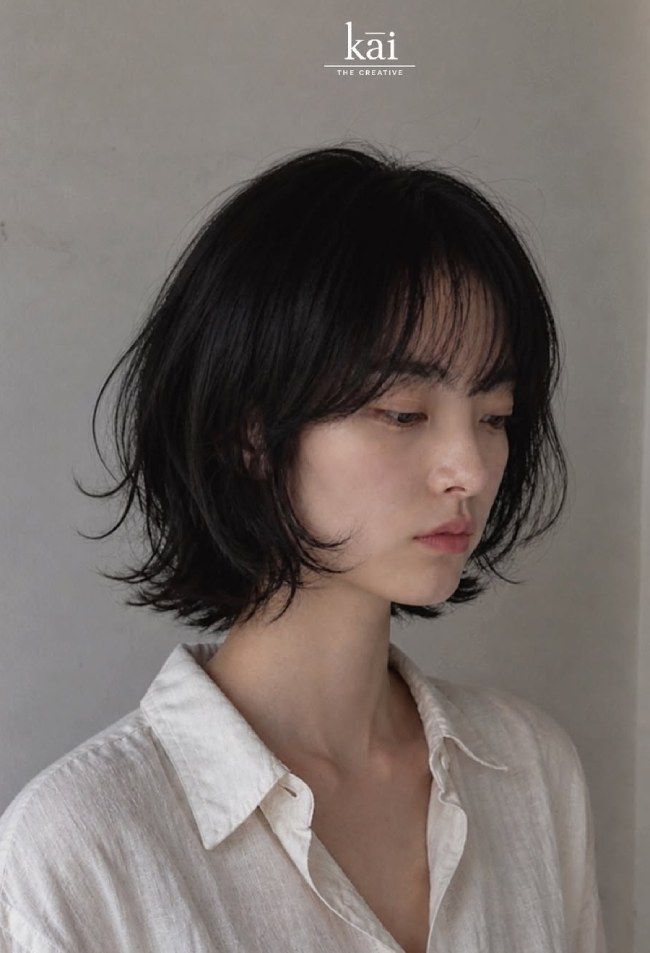 Black Bob With Feathered Layers And Curtain Bangs Black Bob With Feathered Layers And Curtain Bangs — Chin Length Bob