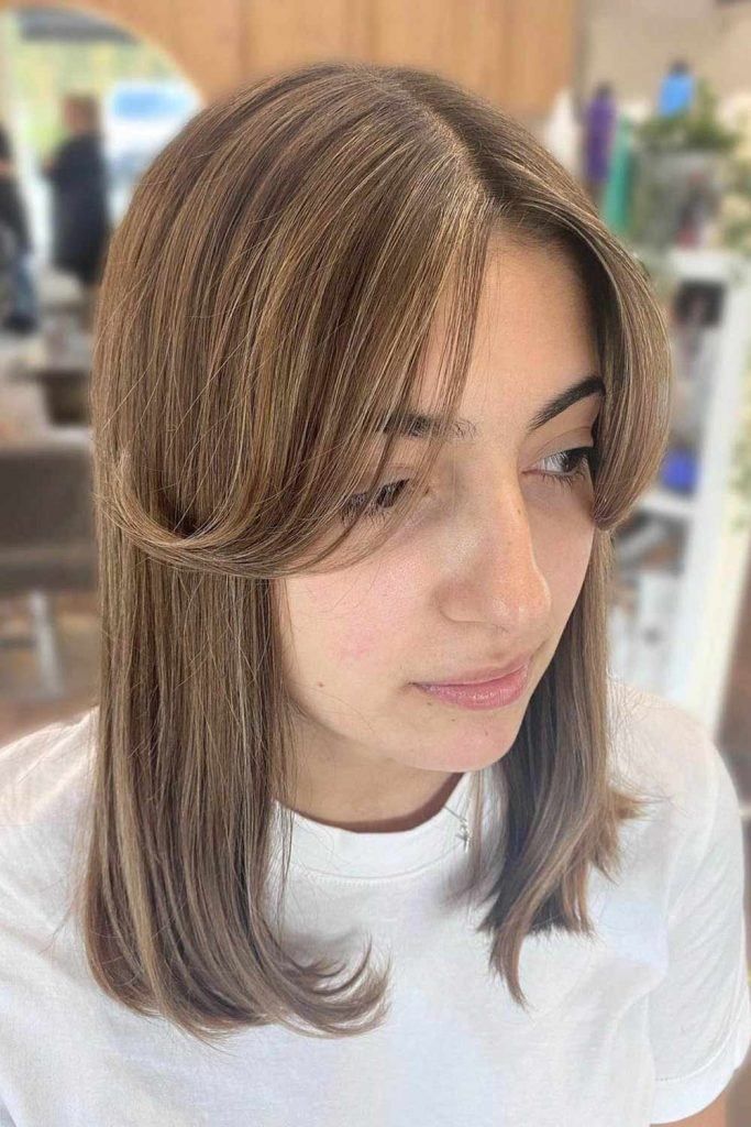Brown With Subtle Highlights Collarbone Layers With Curtain Bangs — Hairstyles for Big Forehead