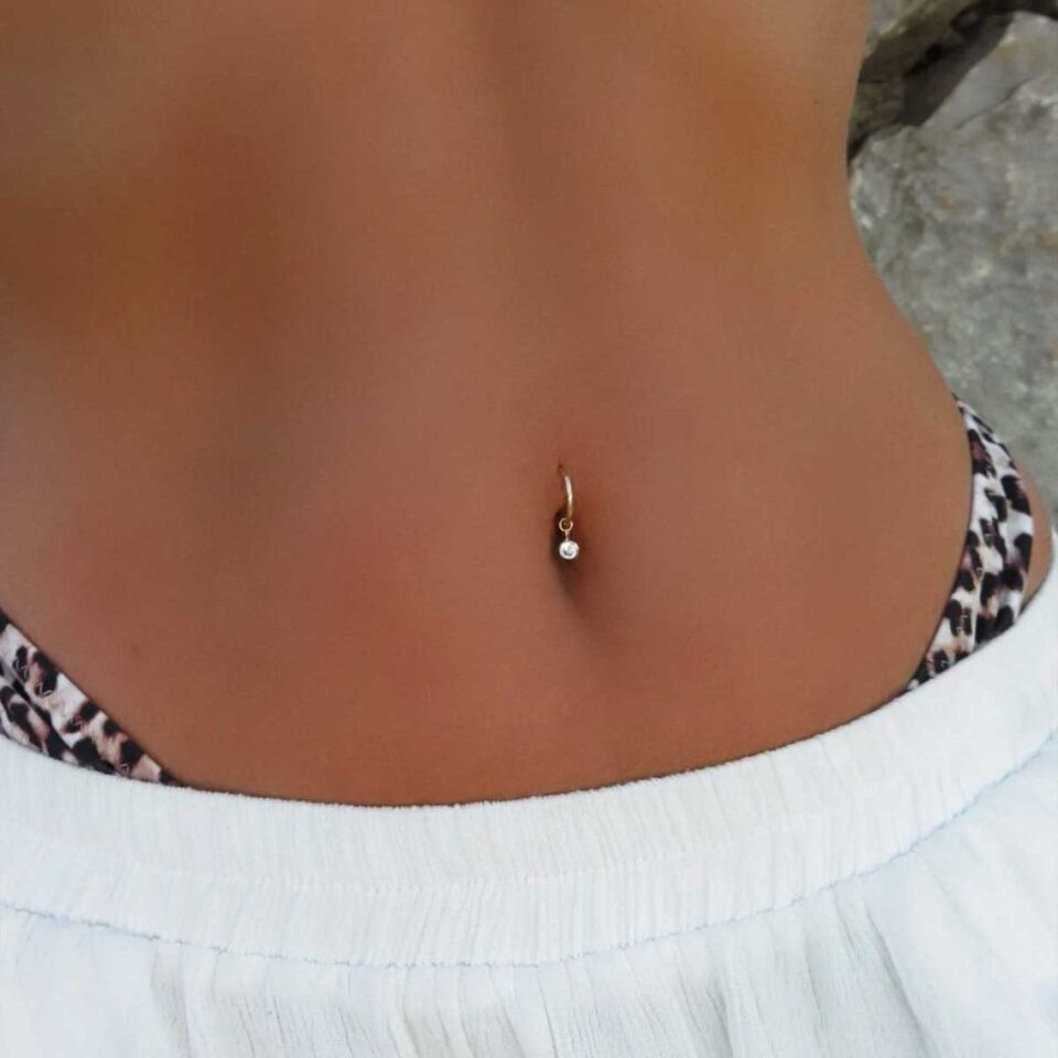 Delicate Dangle: Gold Belly Piercing with Leopard Print Bikini — Belly Button Piercing Ideas