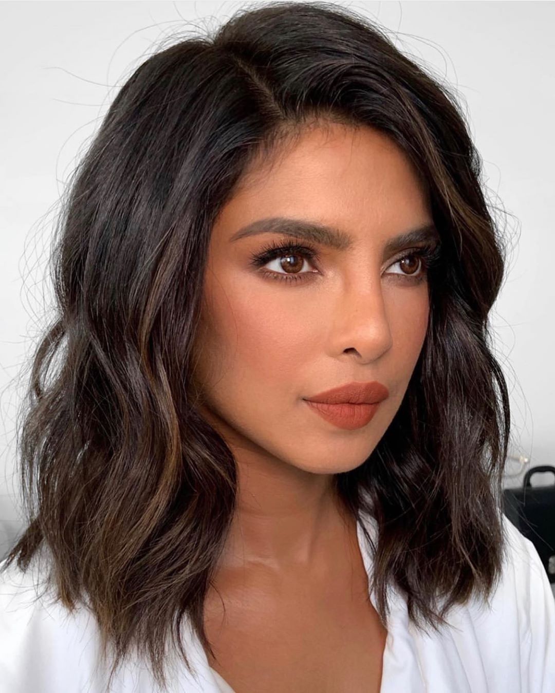 Dark Brown Long Bob With Subtle Waves Dark Brown Long Bob With Subtle Waves — Haircuts for Oval Faces