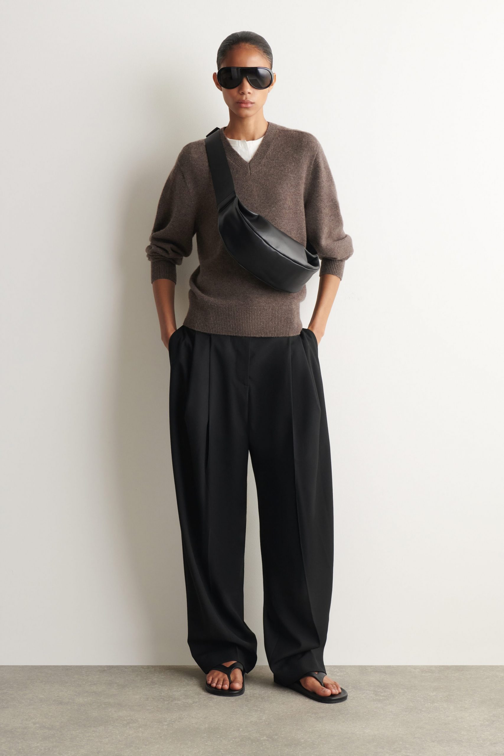 Minimalist Chic with a Black Curved Leather Crossbody — Crossbody Bags