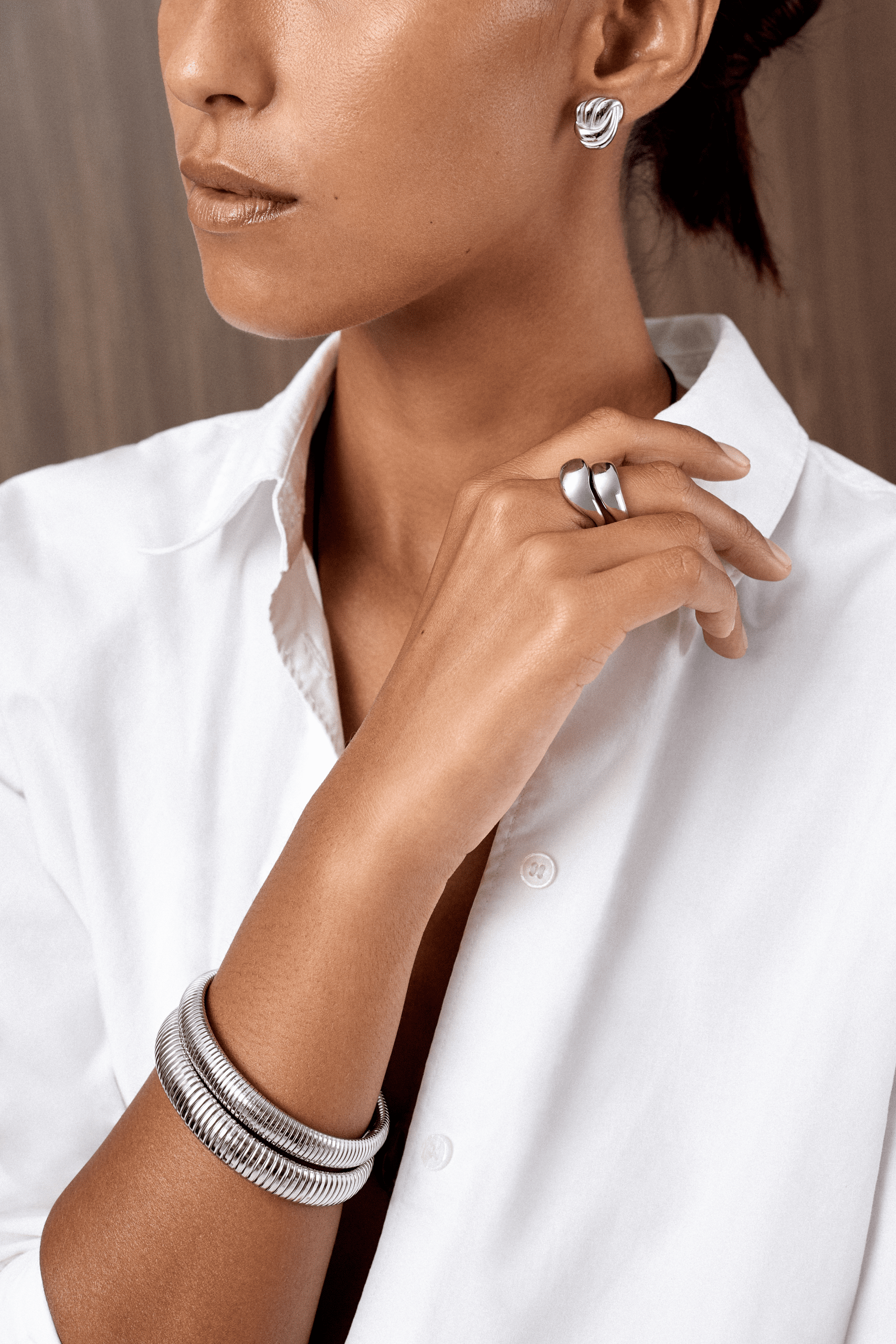 Sculptural Silver Rings and Bangles with a White Shirt Sculptural Silver Rings and Bangles with a White Shirt — Silver Jewelry