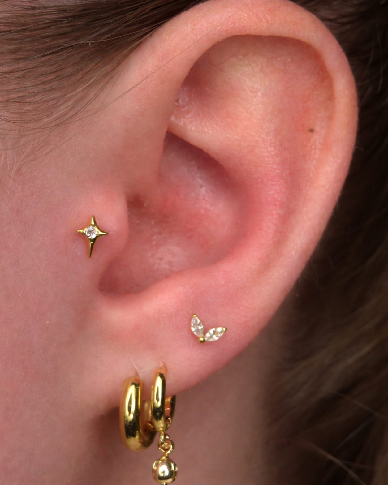 Minimalist Gold Stack with Starburst and Butterfly Studs Minimalist Gold Stack with Starburst and Butterfly Studs — Ear Stack Ideas
