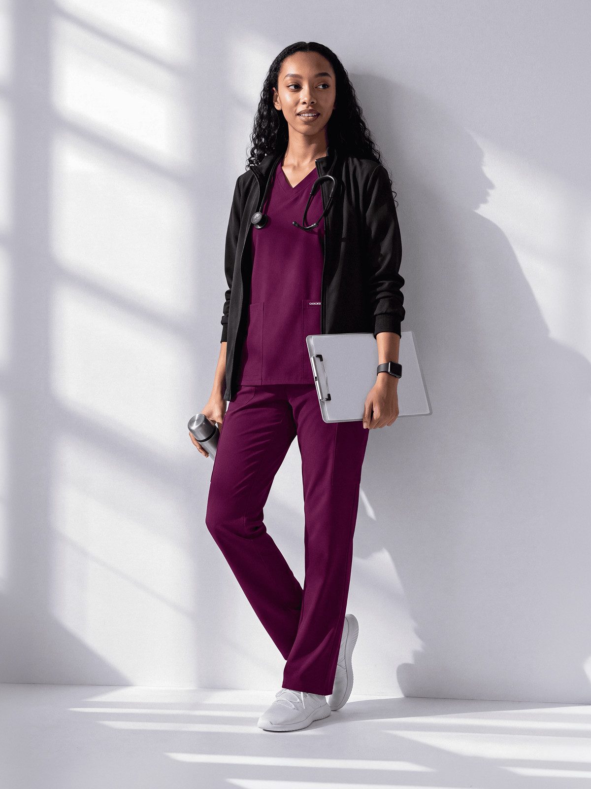 Burgundy Scrub Set Elevated by a Black Zip-Up Jacket Burgundy Scrub Set Elevated by a Black Zip-Up Jacket — Doctor Outfits Women