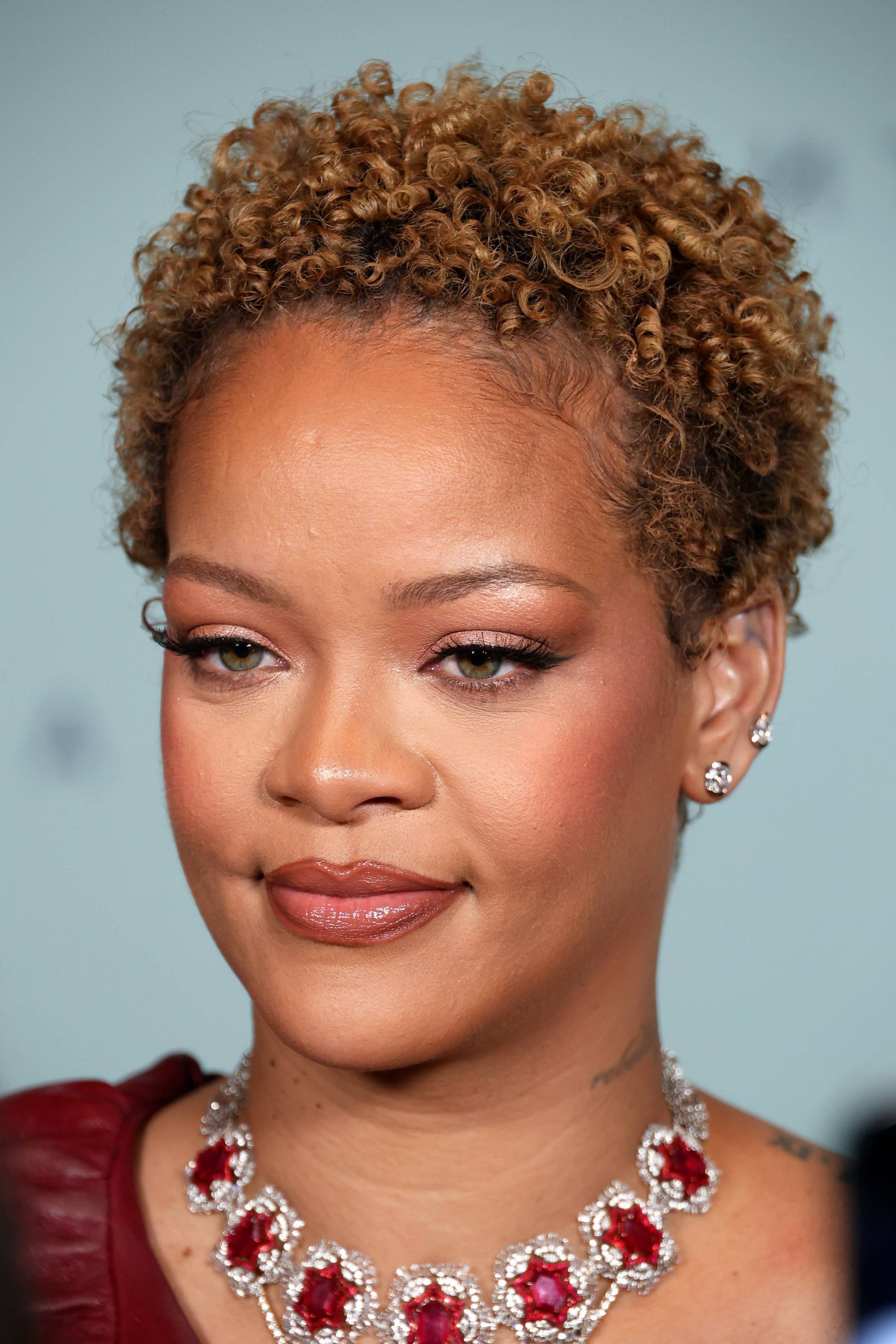 Honey Blonde Short Coils With Side Part — Curly Hairstyles