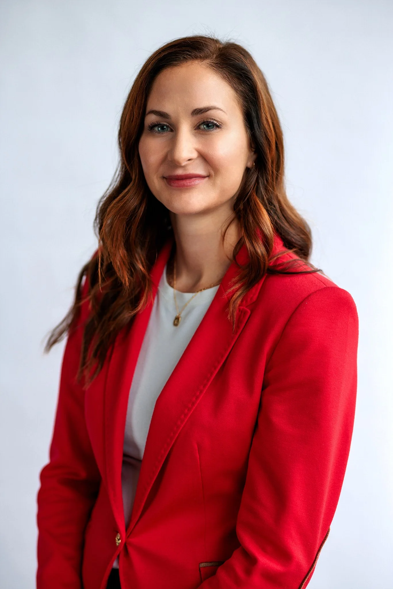 Bold Contrast: Red Blazer Over White T-Shirt with Gold Necklace — Headshot Outfits