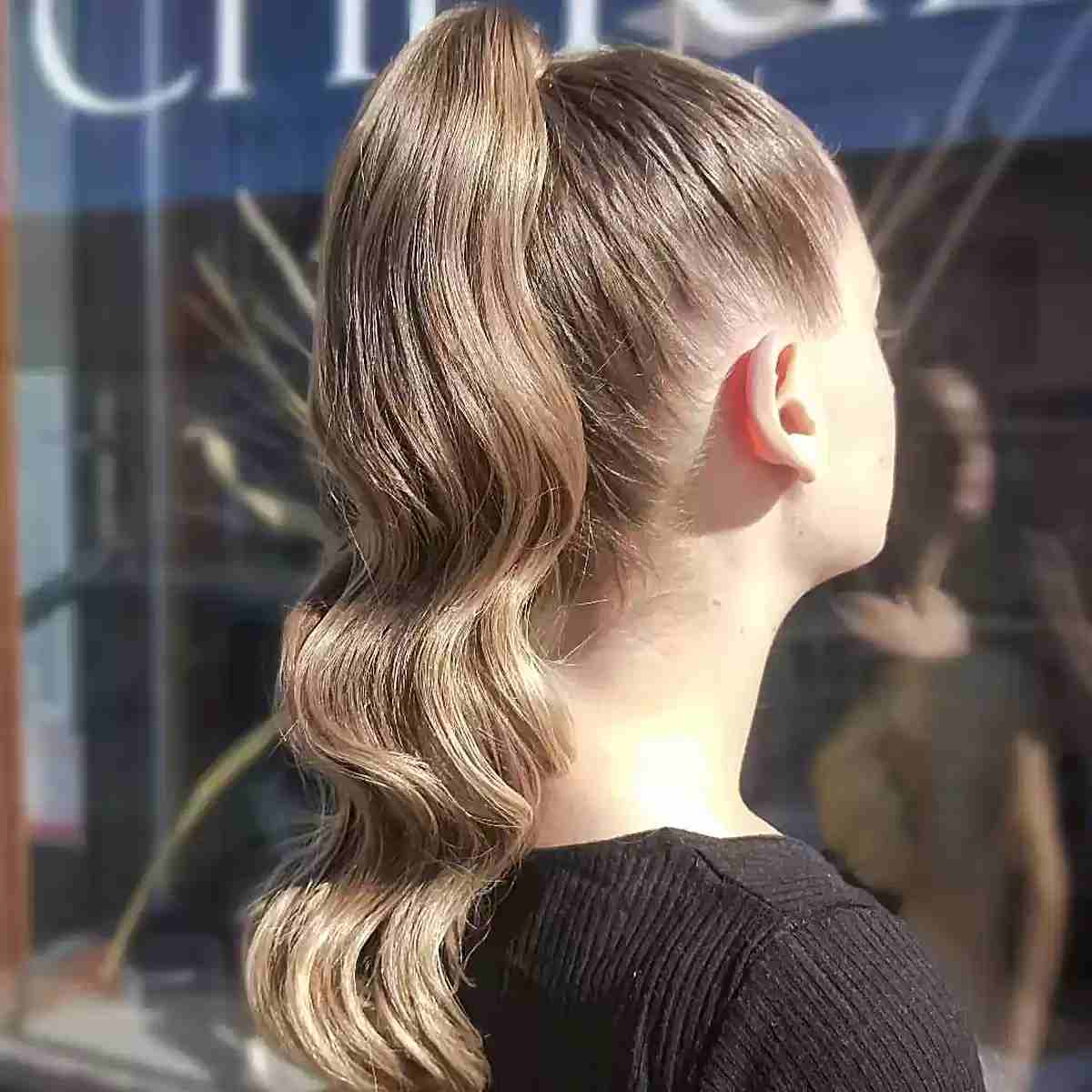 High Ponytail With Loose Waves — Cheer Hairstyles