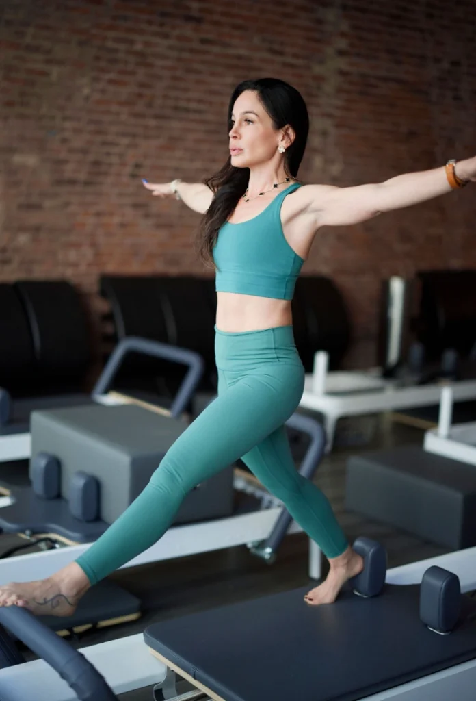 Teal Matching Set on a Pilates Reformer — Pilates Outfits