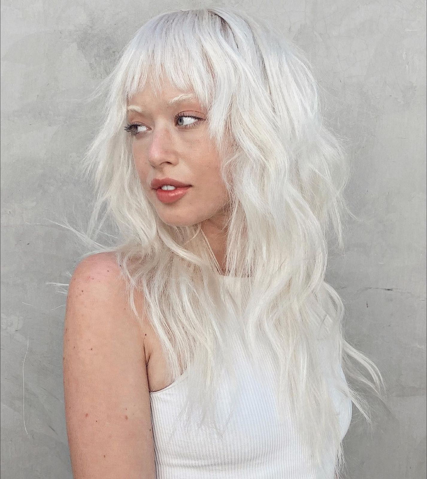 Platinum Blonde Choppy Texture With Wispy Bangs — Long Wolf Cut