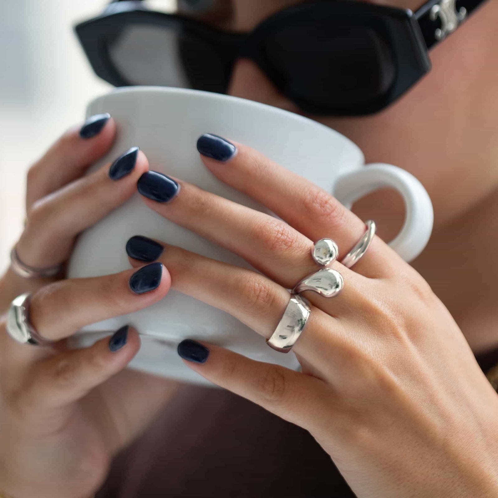 Sculptural Silver Rings with Sunglasses and Brown Top — Chunky Rings