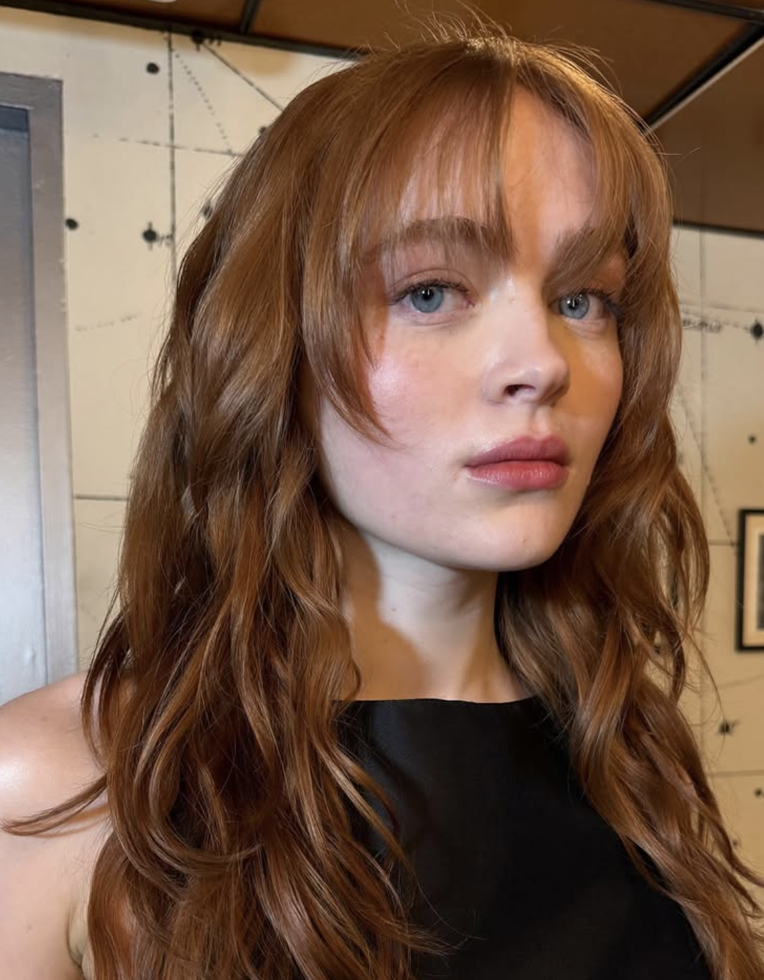 Black Sleeveless Top and Reddish-Brown Wispy Curtain Bangs — Wispy Bangs