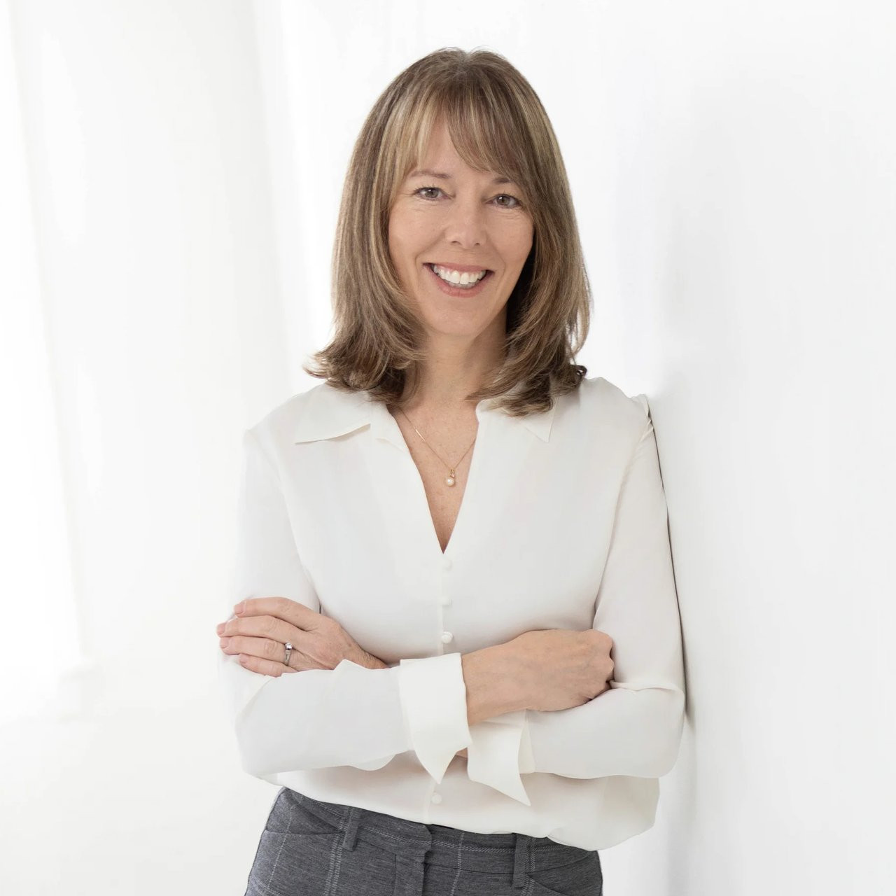 White Sleeveless Top with Grey Trousers White Sleeveless Top with Grey Trousers — Real Estate Agent Outfits