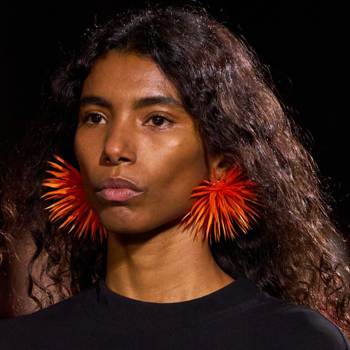 Avant-Garde Orange Starburst Earrings with a Black T-Shirt Avant-Garde Orange Starburst Earrings with a Black T-Shirt — Statement Earrings Outfits