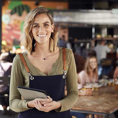 Olive Green Top with Navy Apron for Hospitality Roles Olive Green Top with Navy Apron for Hospitality Roles — Hostess Outfits