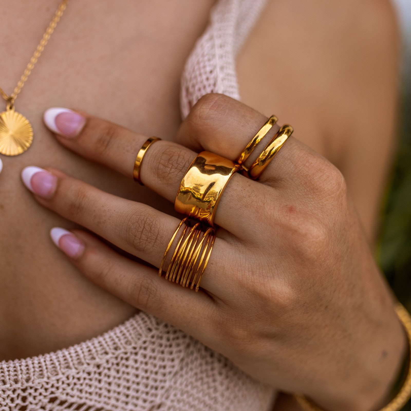 Delicate Gold Bands Paired with a Light Knit Delicate Gold Bands Paired with a Light Knit — Gold Ring Stack