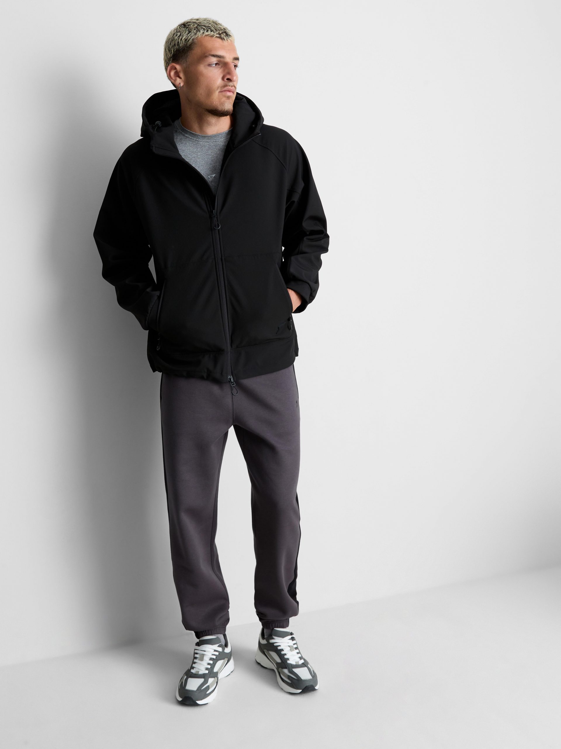 Layered Gym Look: Grey Tee, Black Hooded Jacket, and Sweatpants — Mens Gym Outfits