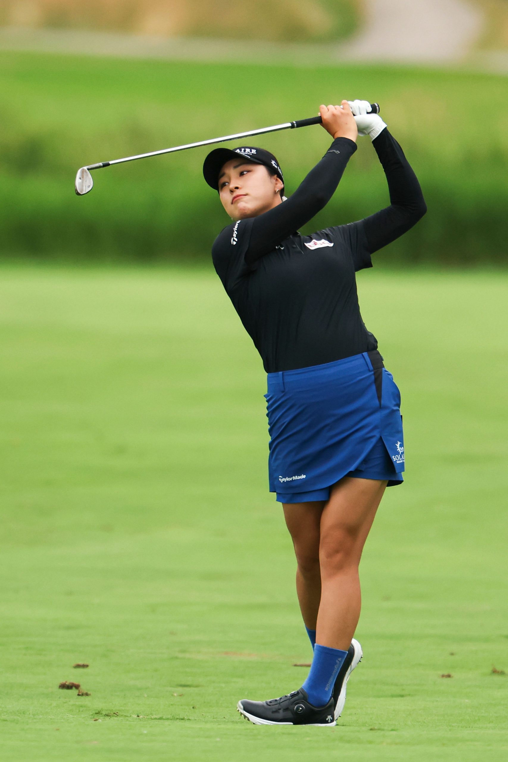 Black Long-Sleeve Top with Blue Flared Skirt — Golf Tournament Outfits