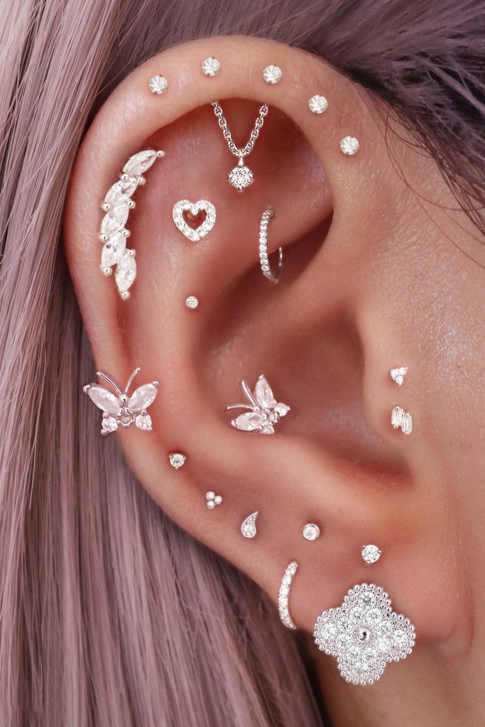 Dazzling Silver Curation with Butterfly and Clover Studs Dazzling Silver Curation with Butterfly and Clover Studs — Ear Piercing Ideas
