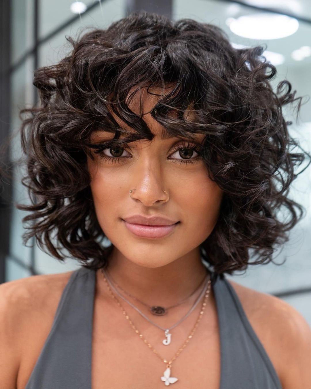 Dark Bob With Textured Curtain Bangs Dark Bob With Textured Curtain Bangs — Haircuts for Curly Hair