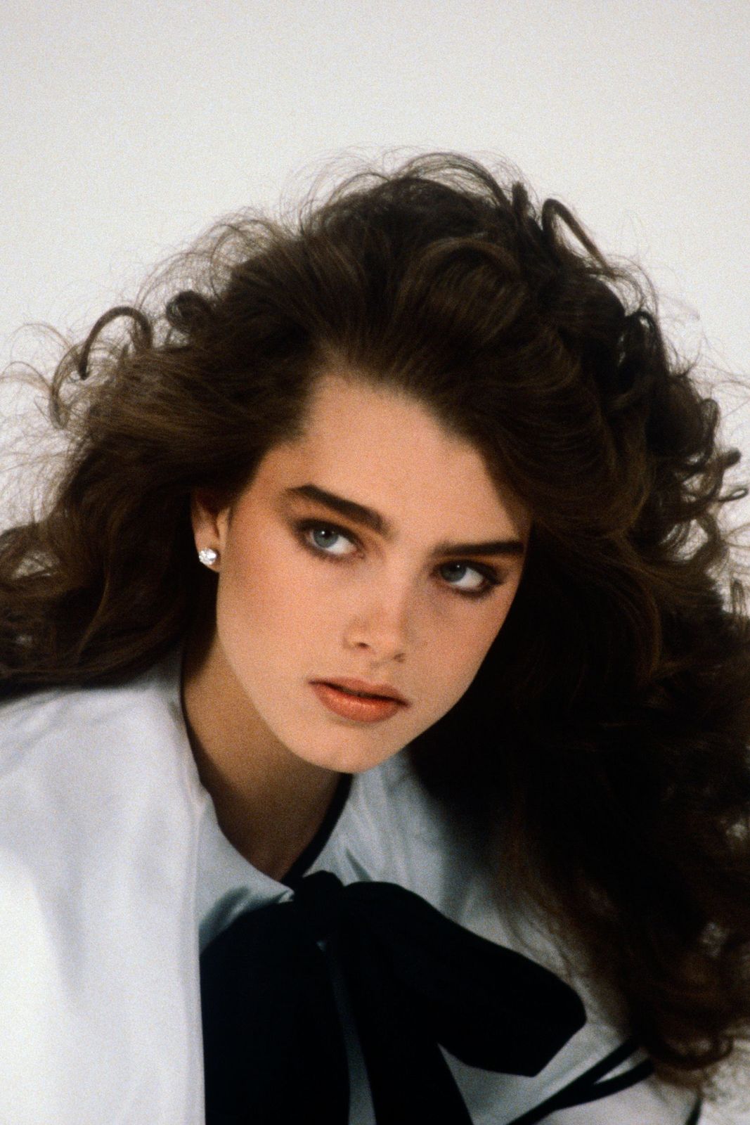 Mid-Back Dark Brown Teased Blowout — 80s Hairstyles