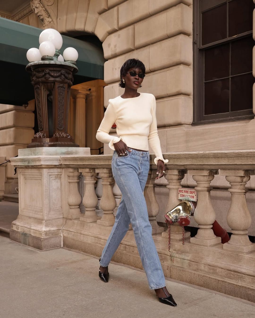 Fitted Jeans, Cream Knit Top, and Black Pointed-Toe Heels — Heels with Jeans Outfits
