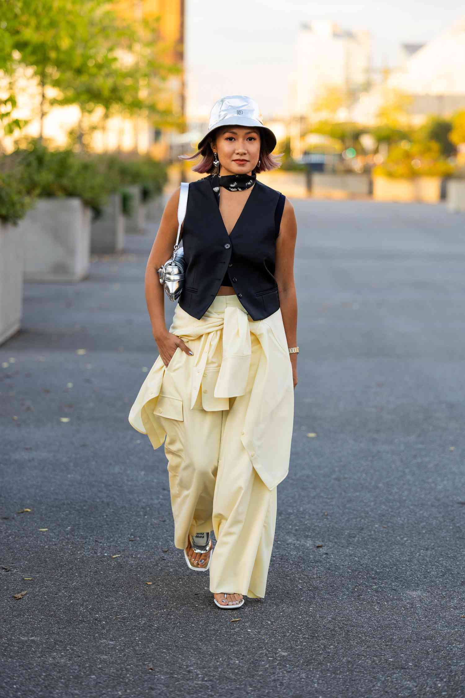Pale Yellow Palazzo Pants Layered with a Vest and T-Shirt Pale Yellow Palazzo Pants Layered with a Vest and T-Shirt