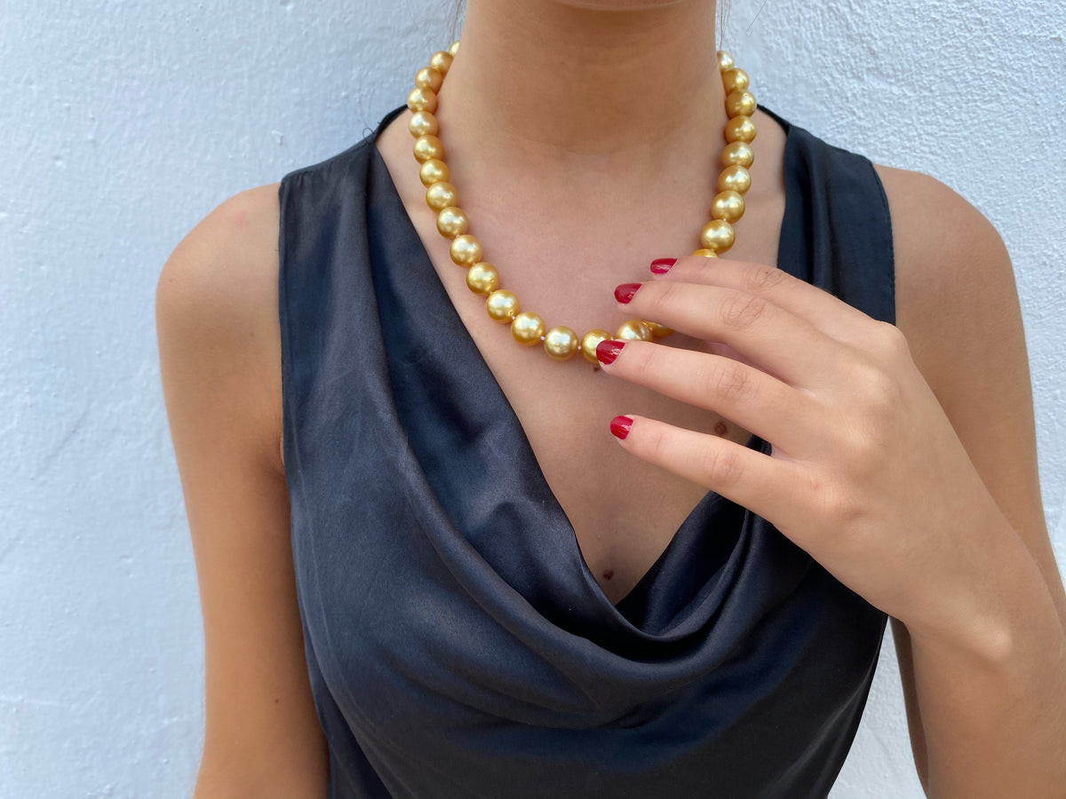 Large Golden Pearl Necklace with Black Satin Cowl Neck Top Large Golden Pearl Necklace with Black Satin Cowl Neck Top — Pearl Necklace Outfits