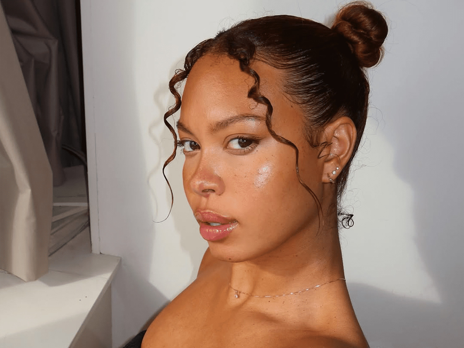 Low Bun With Soft Face-Framing Tendrils — Natural Hair Bun