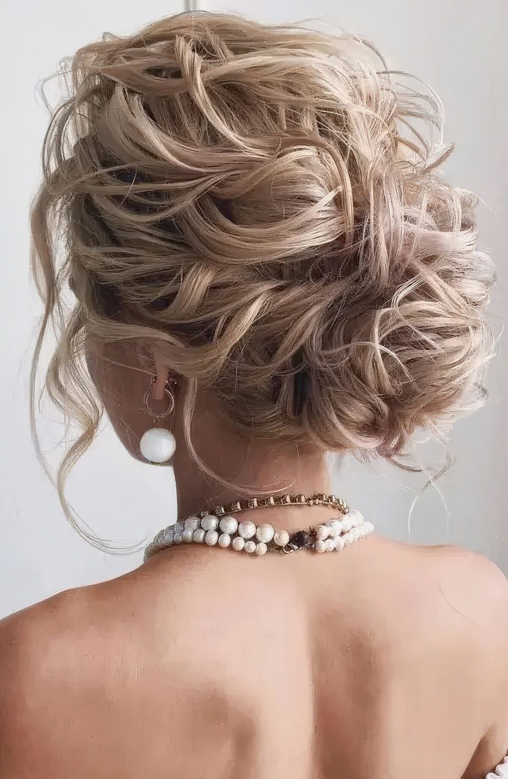 Voluminous Blonde Messy Low Bun