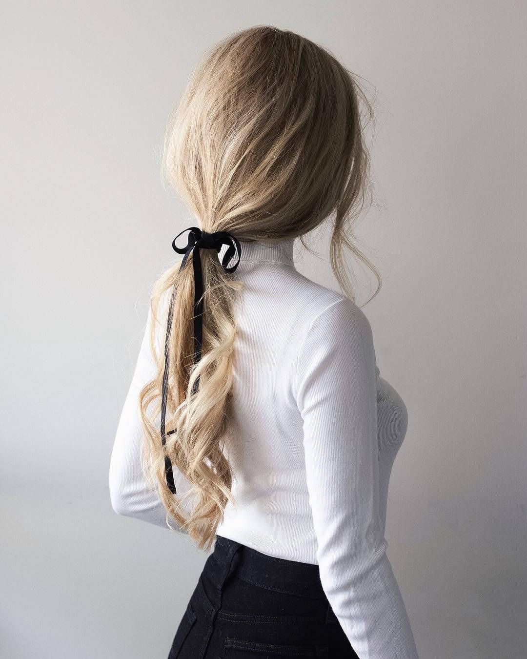 Blonde Low Ponytail With Black Ribbon Bow — Low Ponytail with Bow