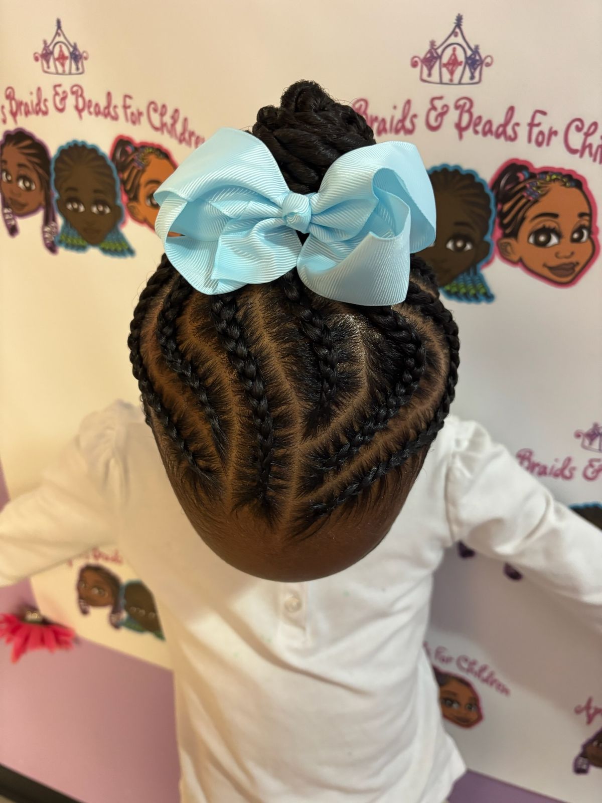 Heart-Shaped Braided Updo With Bow — Dance Recital Hairstyles