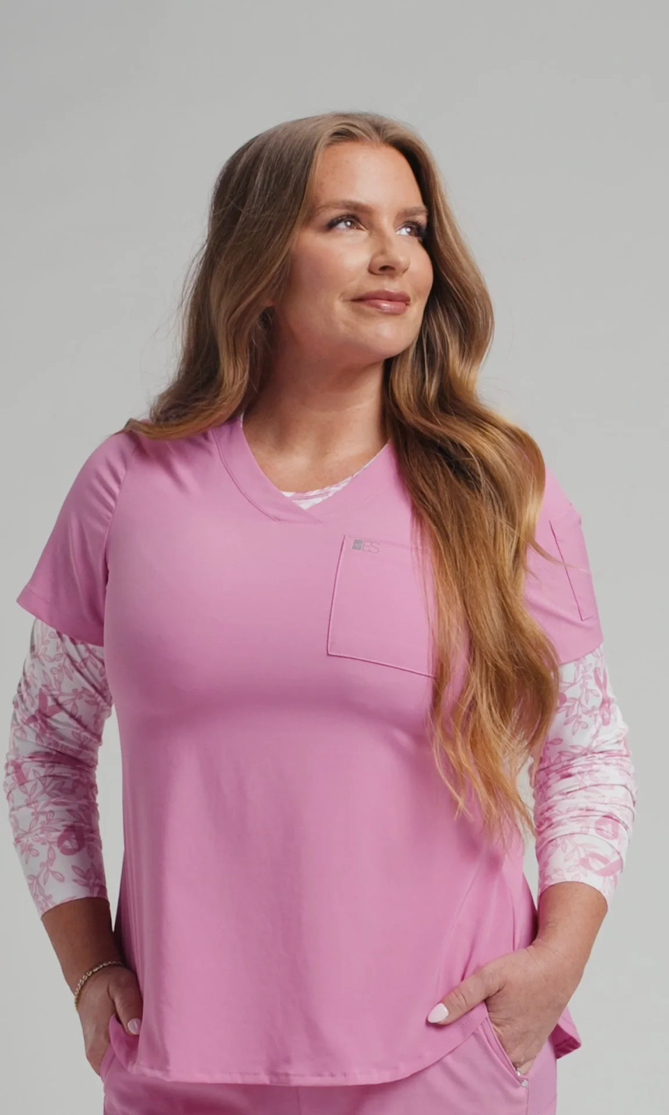 Layered Pink Scrub Top Over a Floral Undershirt Layered Pink Scrub Top Over a Floral Undershirt — Doctor Outfits Women