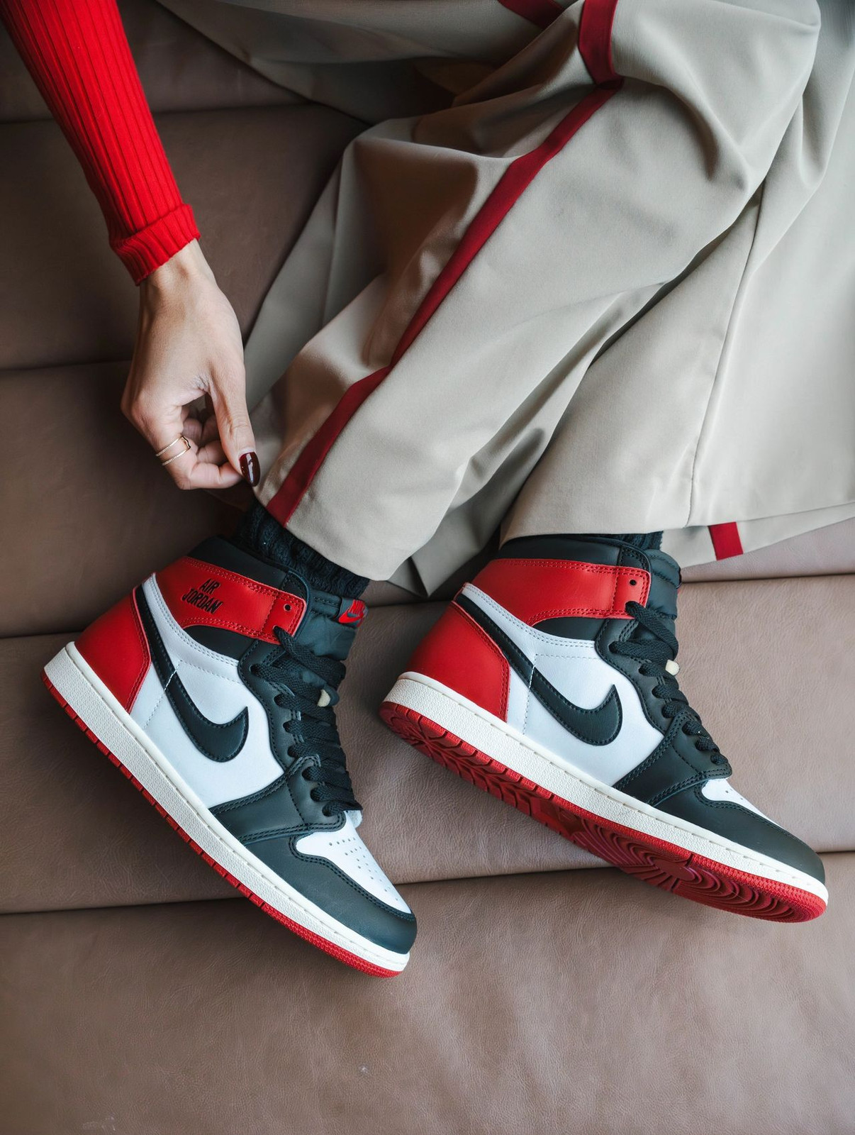 Iconic 'Black Toe' Jordan 1s with Red Top and Tan Pants — Jordan 1 Outfits