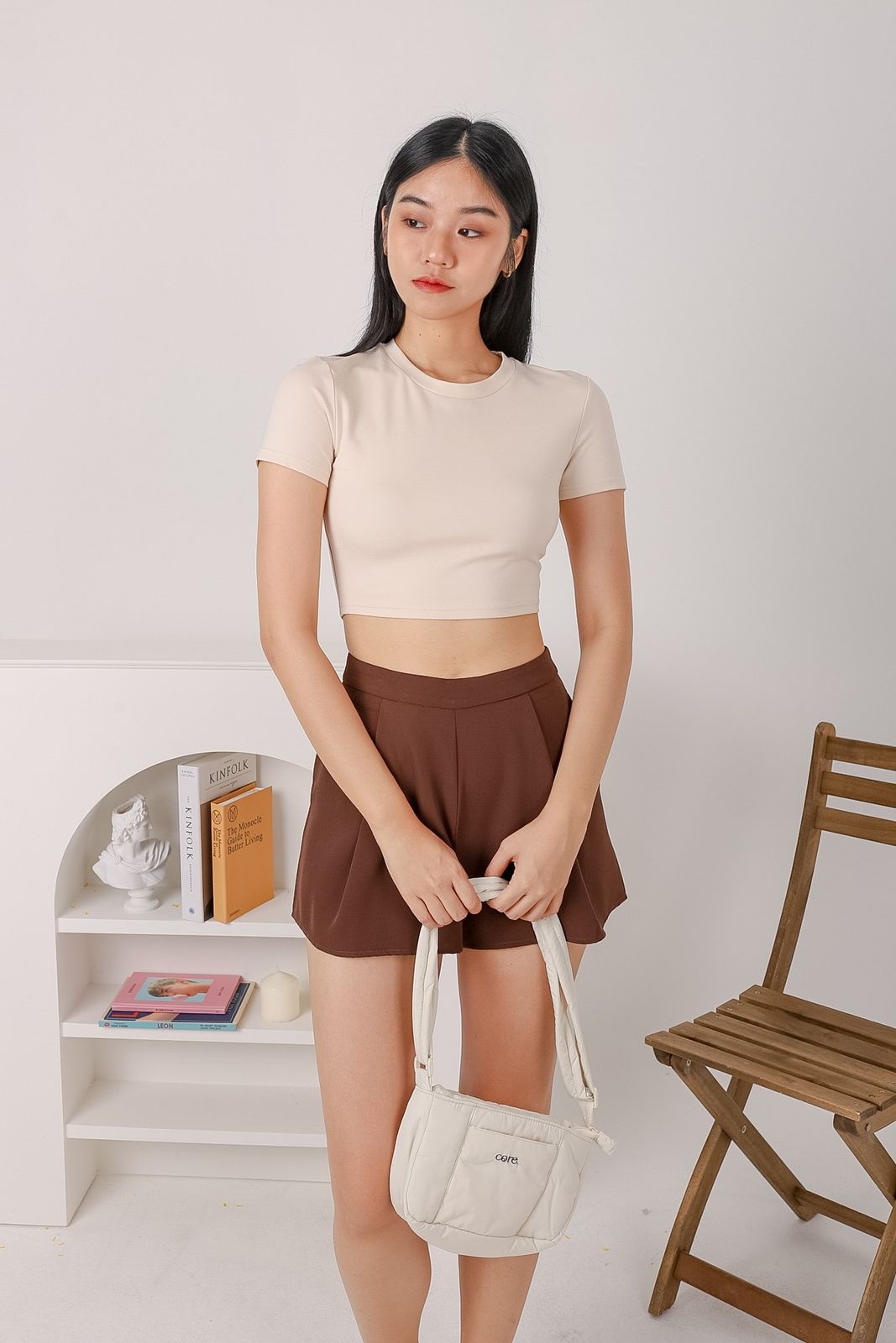 Cream Baby Tee with High-Waisted Brown Shorts and Quilted Bag Cream Baby Tee with High-Waisted Brown Shorts and Quilted Bag — Baby Tee Outfits