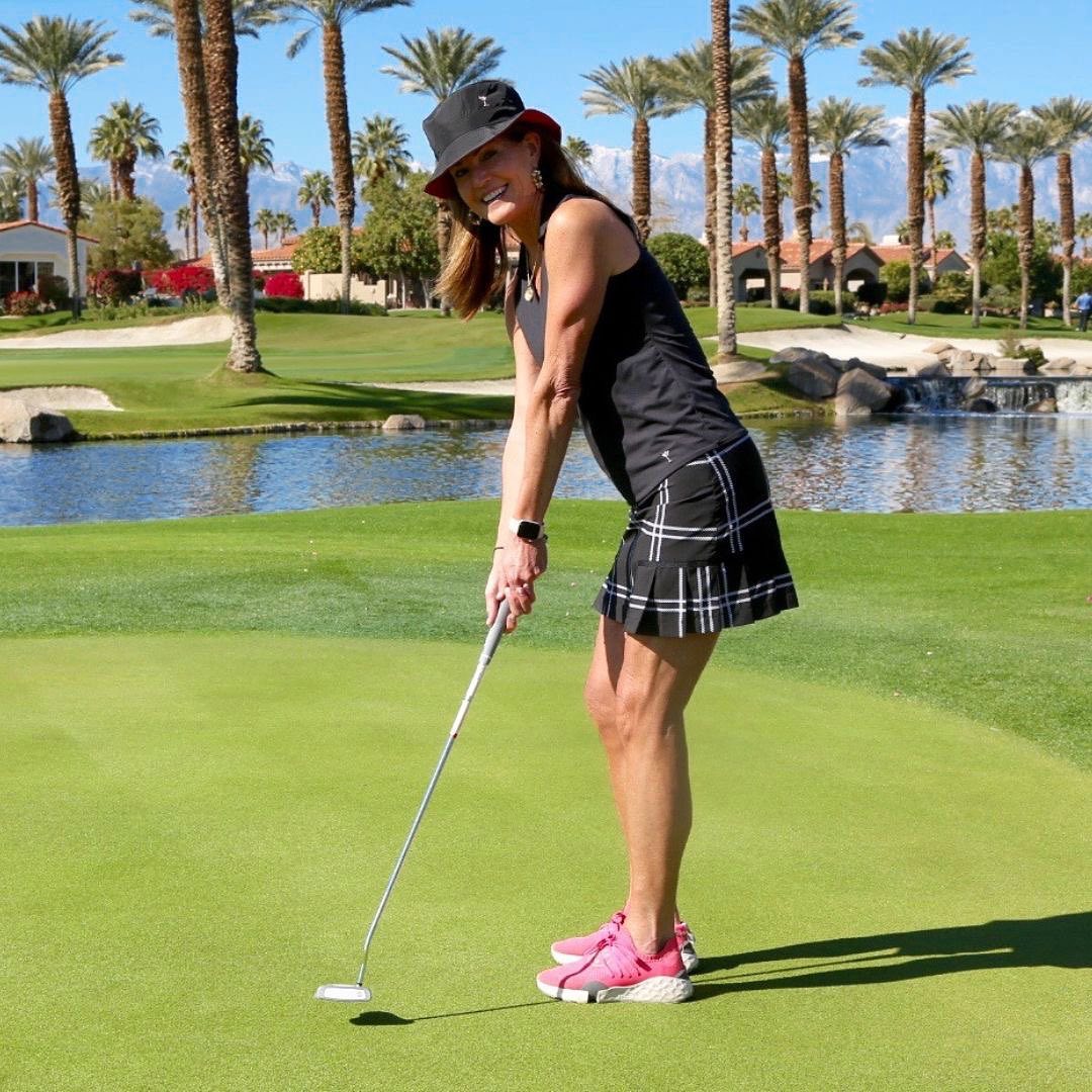 Black Top and Plaid Skort with Pink Sneakers for a Playful Golf Vibe Black Top and Plaid Skort with Pink Sneakers for a Playful Golf Vibe — Golf Outfits