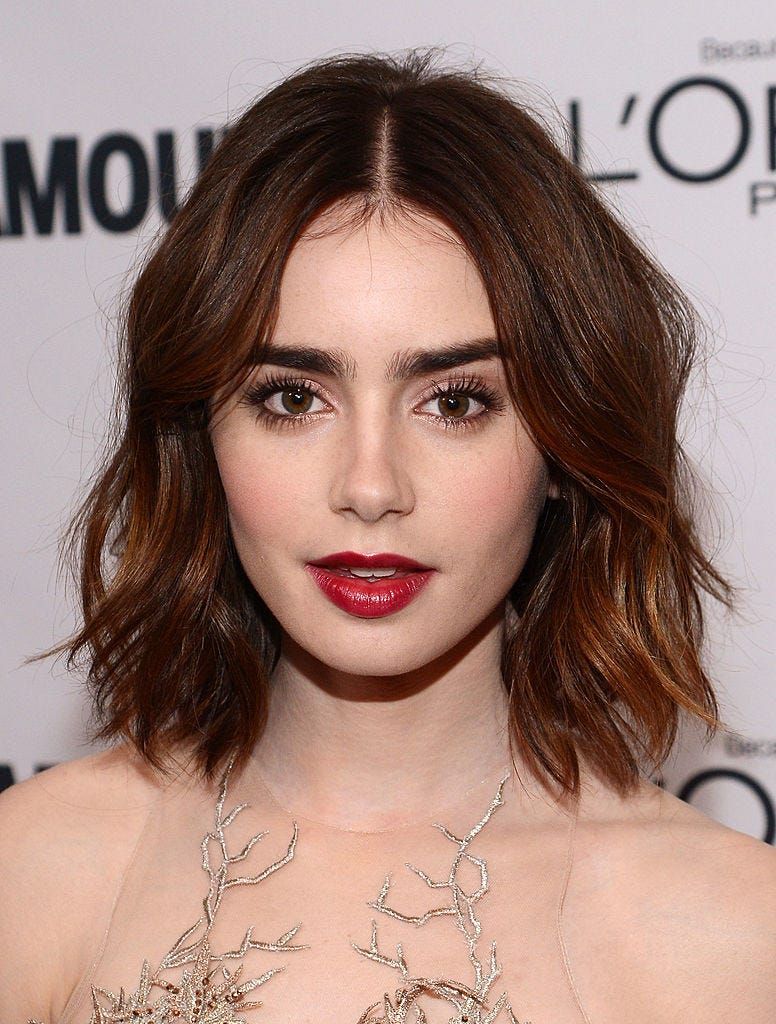 Wavy Bob With Blunt Bangs and Auburn Tones — Haircuts for Wavy Hair