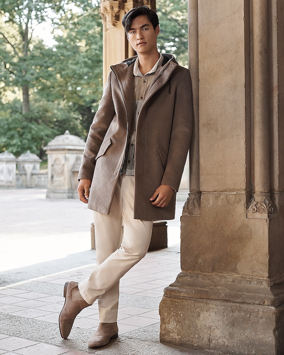 Hooded Coat over Patterned Shirt and Cream Trousers Hooded Coat over Patterned Shirt and Cream Trousers — Mens Business Casual Outfits