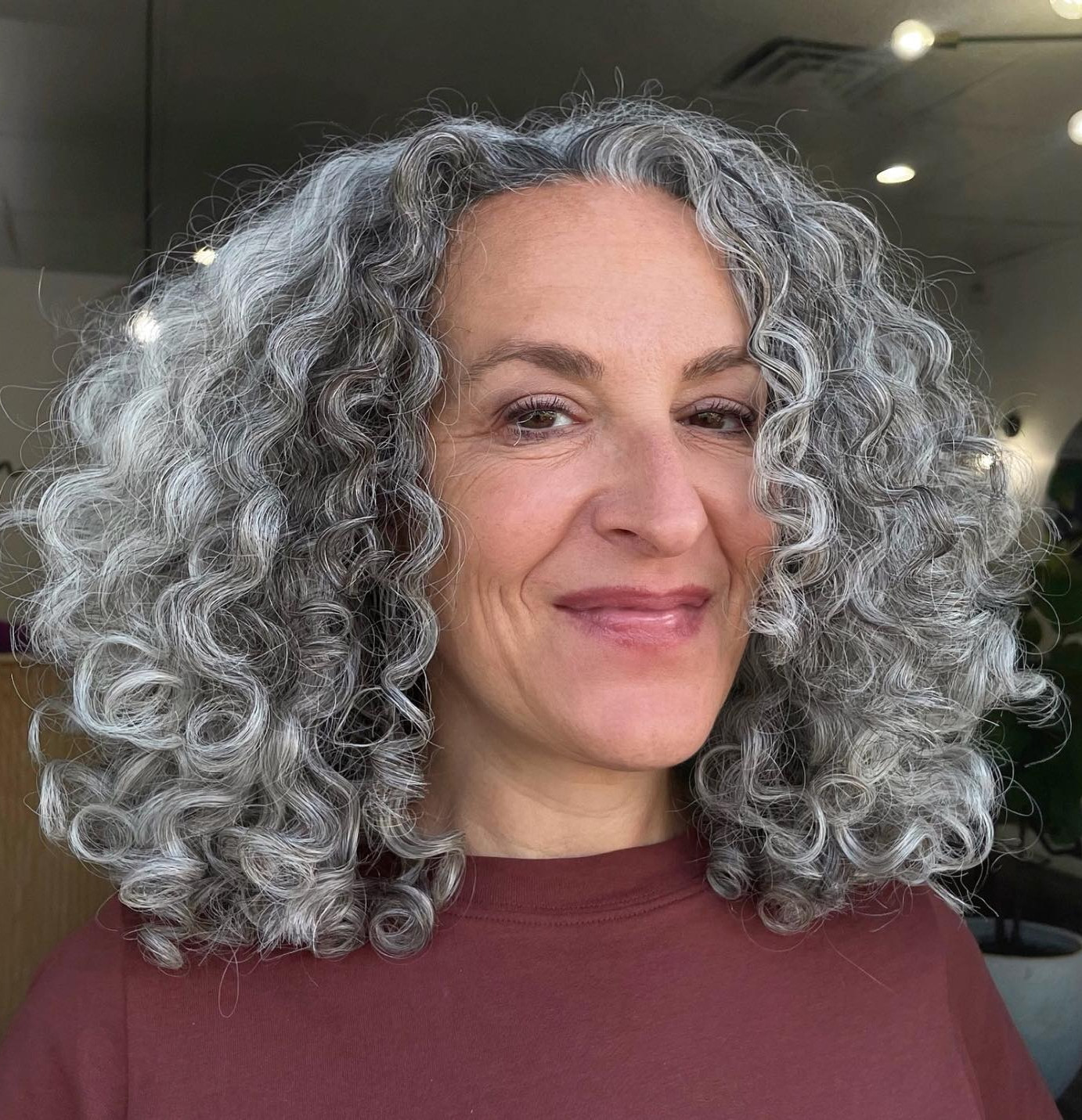 Collarbone Length Grey Curls With Middle Part — Natural Hairstyles Over 50
