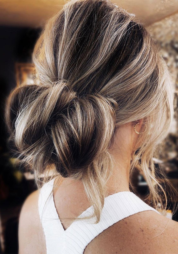 Textured Dark Brown Bun with Blonde Highlights — Messy Low Bun