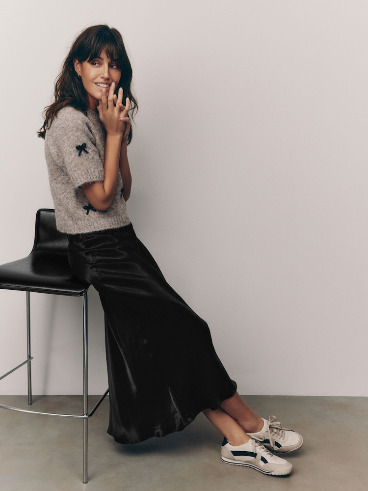 Black Satin Midi Skirt with Bow Detail Sweater for Playful Casual Black Satin Midi Skirt with Bow Detail Sweater for Playful Casual — Satin Skirts