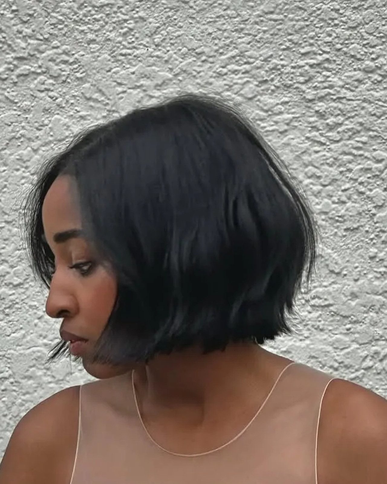 Chin Bob Tucked Behind One Ear Chin Bob Tucked Behind One Ear — Relaxed Hair Bob