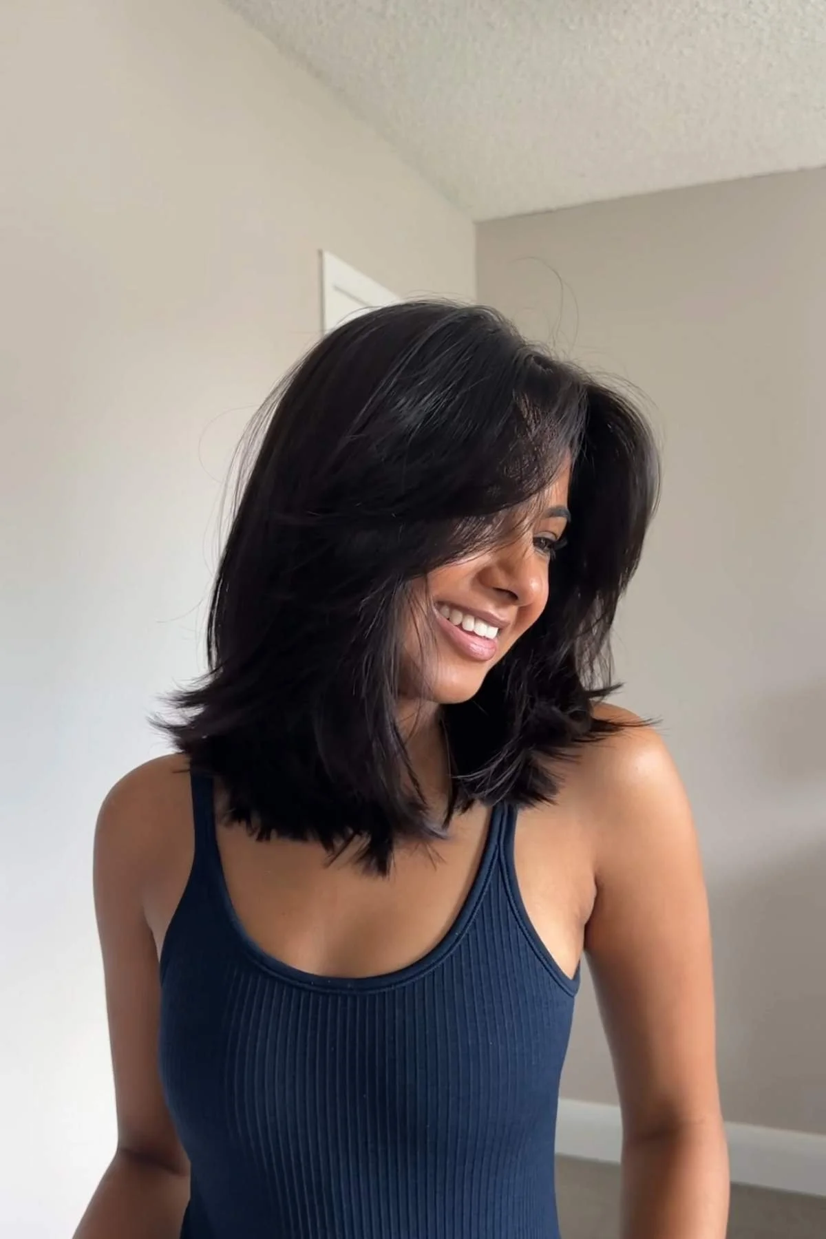 Layered Haircut Thick Dark Brown Layered Cut With Curtain Bangs — Shoulder Length Hairstyles