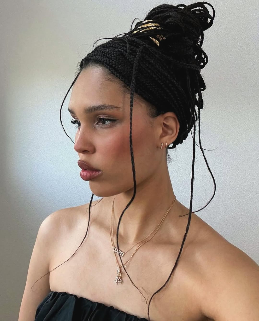 Sleek Low Bun With Face-Framing Strands — Knotless Braids Updo