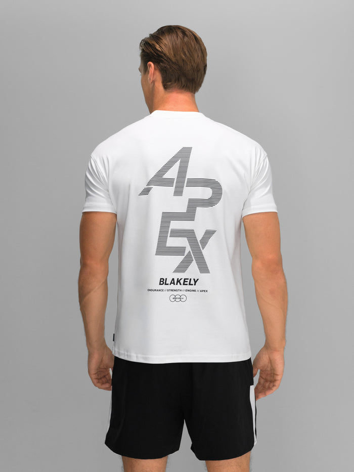 Graphic Statement: White T-Shirt with Large Print and Black Shorts — Mens Gym Outfits